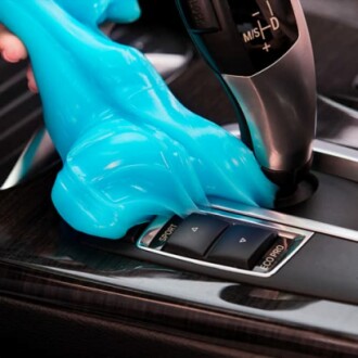 Blue cleaning gel used on car gear shift area.
