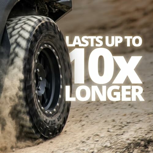 Close-up of a durable tire on a dirt road with text 'Lasts up to 10x longer'.